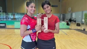 Ashwini Ponnappa, left, and Tanisha Crasto pose with their title.