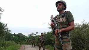 Indian Army officials patrol in the violence-hit area in Manipur.