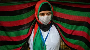 Afghans residing in India take part in a demonstration outside the UN Refugee Agency ( UNHCR) office in New Delhi on August 23, 2021 to protest against the Taliban's military takeover of Afghanistan. 