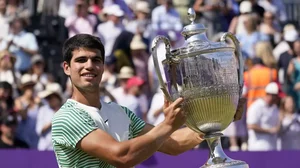 Alcaraz celebrates with his trophy after defeating de Minaur in London on Sunday.