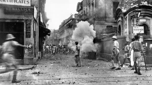 Calcutta policemen use tear gas bombs during the communal riots in the city.