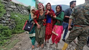 Family members grieve for their missing relatives in a landslide after heavy rains at Boh village in Kangra, Himachal Pradesh. (Photo: Getty Images)