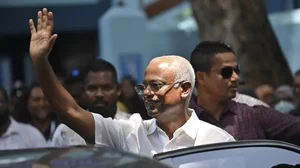 President of the Maldives Ibrahim Mohamed Solih waves after casting his vote 