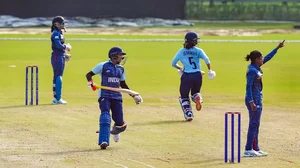 A cricket match going on between Sri Lanka and the Indian women's cricket team