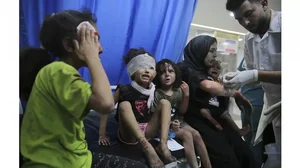 Palestinian children wounded in Israeli strikes are brought to Shifa Hospital in Gaza City.