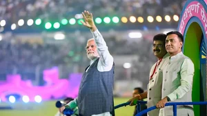 Prime Minister Narendra Modi waves to spectators at the Jawaharlal Nehru Stadium in Fatorda.