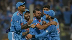 Mohammad Shami celebrates the wicket of Sri Lanka's Dushan Hemantha in Mumbai.