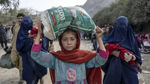 Afghan refugees return to Afghanistan through the Torkham Pakistan-Afghanistan border, in Torkham, Afghanistan.