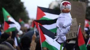 A mock dead baby is carried during a demonstration to support the Palestinian people in Gaza