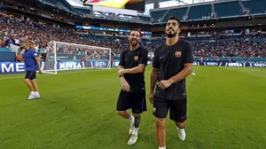 Lionel Messi (left) and Luis Suarez (right) survey the Hard Rock Stadium pitch in 2017