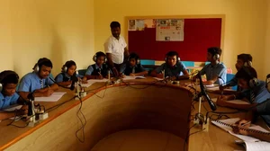 Debabrata Behera conducts a class with students with hearing disability. 