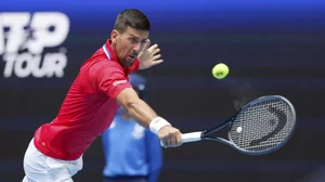 Novak Djokovic of Serbia hits a return to Jiri Lehecka of the Czech Republic during the United Cup tennis tournament in Perth.