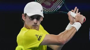 Australia's Alex de Minaur plays a backhand return to Germany's Alexander Zverev during their United Cup semifinal tennis match in Sydney.