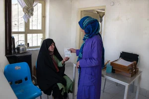 Shared by MSF : Najiba, an MSF midwife, seeing a patient in the MSF-supported Band-e-Amir community health facility in Bamyan, Afghanistan