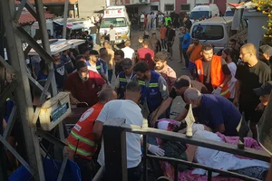 | Photo: AP : Lebanon Pager Explosions: Civil Defense first-responders carry a man in the southern port city of Sidon