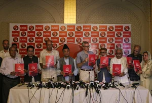 Photo by Firdous Nazir Nur via Getty Images : Omar Abdullah, the former chief minister of Jammu and Kashmir and National Conference (NC) Vice President, along with his colleagues, releasing the manifesto of the party for the upcoming Legislative Assembly elections in Srinagar, Jammu and Kashmir, on August 19, 2024. 