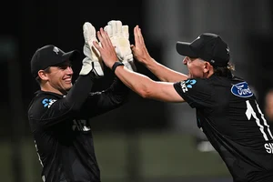 | Photo: Andrew Cornaga/Photosport via AP : NZ vs SL 2nd ODI: New Zealand's Nathan Smith celebrates with Tom Latham after taking a catch to dismiss Eshan Malinga