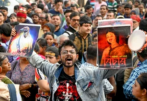 PTI : A member of 'Abhaya Mancha' during a protest as Sanjay Roy, accused in the alleged rape and murder of an on-duty doctor at R G Kar Medical College and Hospital, is produced at a Kolkata court on the day of the verdict, in Kolkata, Saturday, Jan. 18, 2025. 