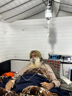 PTI : Farmer leader Jagjit Singh Dallewal, who has been on fast-unto-death, receives medical aid after the Centre announced to hold a meeting with Punjab's protesting farmers on February 14 in Chandigarh to discuss their demands, at Khanauri in Sangrur district of Punjab, Sunday, Jan. 19, 2025. 