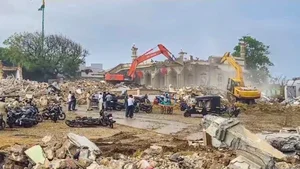 PTI : Excavators being used to demolish illegal settlements near Somnath Temple, in Gir Somnath district, Gujarat, Saturday, Sept. 28, 2024.