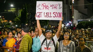 PTI : A man holds a placard during a 'mass convention' called by junior doctors near the hunger strike site, protesting against the alleged rape and murder of a trainee doctor, in Kolkata, Friday, Oct. 11, 2024.