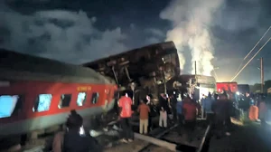 PTI : Passengers near the derailed coaches after an express train rammed into a stationary train, at Kavarapettai in Tiruvallur district, Friday, Oct. 11, 2024.