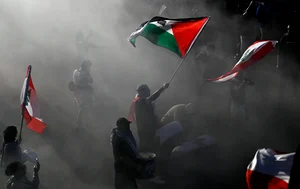 Justin Tang/The Canadian Press via AP : Pro-Palestinian demonstrators wave flags during in a rally in Ottawa, Ontario, Saturday, Oct. 5, 2024, days before the one-year anniversary of Hamas' attack in southern Israel and Israel's response to go to war on Hamas