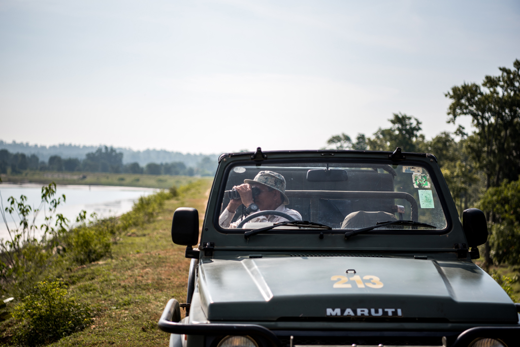 Rakesh Solanki, a naturalist working with Singinawa Jungle Lodge, Kanha, whose career spans more than two decades, spotting birds at Bhimodi Lake