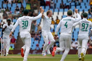 | Photo: AP/Themba Hadebe : SA vs PAK 1st Test Day 1: South Africa's Corbin Bosch, centre, celebrates with teammates after taking a wicket of Pakistan's Shan Masood