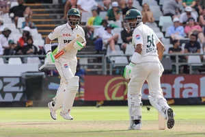 | Photo: AP/Halden Krog : SA vs PAK 2nd Test Day 3: Pakistan's Shan Masood (c) and Pakistan's Babar Azam run between the wickets