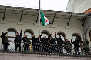 | Photo: AP/Alexander Zemlianichenko : Members of the Syrian diaspora in Moscow