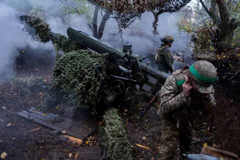 Ukrainian servicemen of Khartia brigade fire D-30 Howitzer towards Russian positions in Kharkiv region, Ukraine, Wednesday, Oct. 16, 2024.  - Alex Babenko/AP