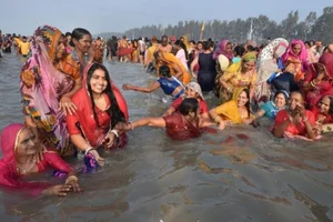 Devotees taking a holy dip at the Gangasagar Mela in 2021. 