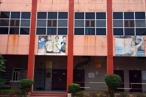 Photo by Tribhuvan Tiwari/Outlook : A picture of the Phogat sisters on the wall at Mahavir Phogat VMPS in Jhojhu Kalan, Haryana