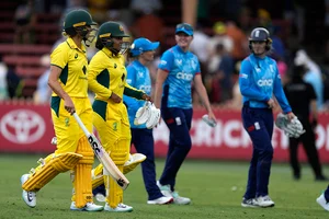 | Photo: AP/Rick Rycroft : AUS-W Vs ENG-W, 1st ODI: Australia's Alana King and Ashleigh Gardner, left, walk off after winning the match