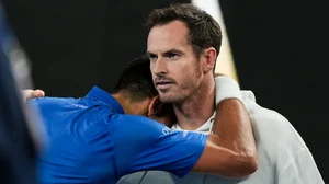 Novak Djokovic embraces Andy Murray after his quarter-final win