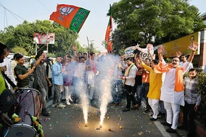 Photo: Getty Images : A Stunning Win: BJP supporters celebrating after 
winning the Haryana 
assembly election