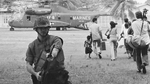 AP File Photo : U.S. Marines provide cover during Operation Eagle Pull as Americans and Cambodians board Marine helicopters in Phnom Penh during the final U.S. pullout of Cambodia on April 12, 1975 |