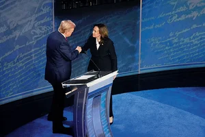 Photo: Getty Images : A Close Contest: Kamala Harris and Donald Trump shake hands ahead of the presidential debate  in Philadelphia on September 10, 2024 