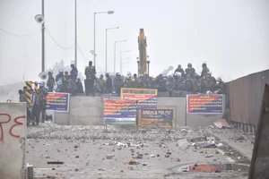 PTI/File : Security personnel stand guard during the protesting farmers' 'Delhi Chalo' march, near the Punjab-Haryana Shambhu Border, in Patiala district, Wednesday, Feb. 21, 2024. 