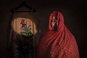 | Photo: Fatma Fahmy : Dreaming of Home: Khwater, 35, from the northern part of Sudan, sought refuge in Egypt with her sister. After her sister passed away from cancer, “the world stopped” for her