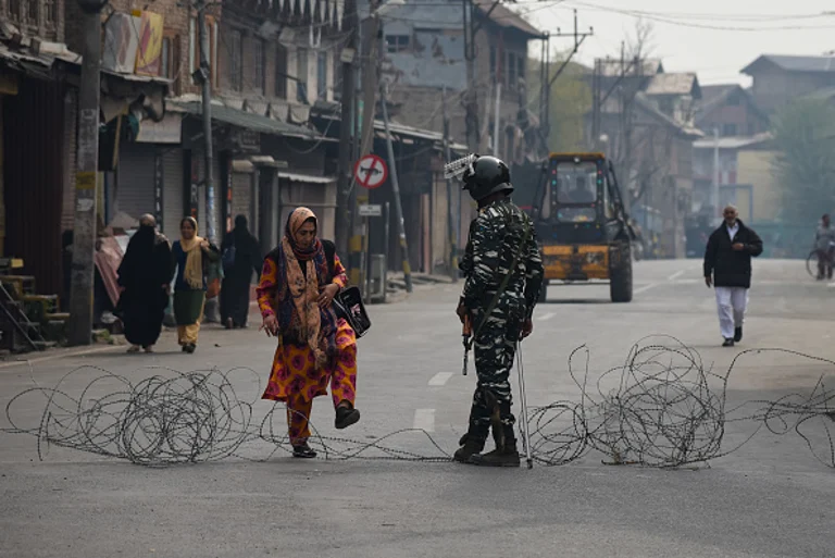 A Kashmiri woman crosses barbed wire as Indian paramilitary

SRINAGAR, JAMMU AND KASHMIR, INDIA - November, 2019 - Getty Images