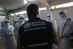 Getty Images : A World Health Organisation (WHO) instructor in a training session with new health workers