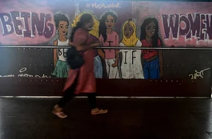 Getty Images : A woman walks past a mural highlighting womens empowerment in Mumbai (Representative image)