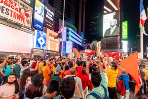 Roy Rochlin/Getty Images : Hindu Americans gather in Times Square to celebrate the reopening of the Ram Mandir Temple in Uttar Pradesh city, believed to the birthplace of Rama during the fourth phase of the coronavirus reopening on August 05, 2020 in New York, New York. 