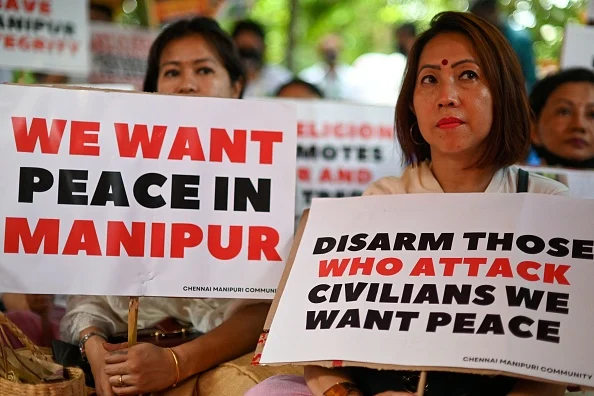 Members of the Chennai Manipuri community hold a peace demonstration