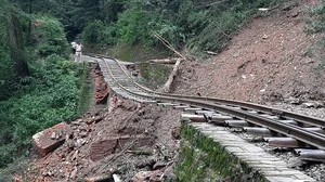 AFP via Getty Images : A view of damaged Shimla-Kalka railway track, an UNESCO world heritage, after 50 meters of a bridge was swept away due to landslides caused by incessant rains |