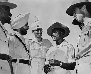 (Photo by Archive Photos/Getty Images). : Lieutenant Daljit Singh Randhawa (1920 - 2016) MC (Military Cross) of the 6th Rajputana Rifles (2nd left), unidentified soldier, Sergeant Robinson Okeke of the 82nd (West Africa) Division and Captain AP Brown of the British Indian Army in discussion at the Rajputana Rifles Training Centre circa July 1944 at New Delhi, India. 