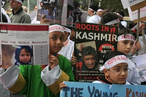 Getty Images : A team of from All Parties Migrant Coordination Committee (APMCC), an organisation of Kashmiri Pandits examine the damaged abandoned Kashmiri Pandit (Hindus) residential houses 