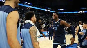 Jaren Jackson Jr. #13 of the Memphis Grizzlies celebrates a victory against the Minnesota Timberwolves with teammates.